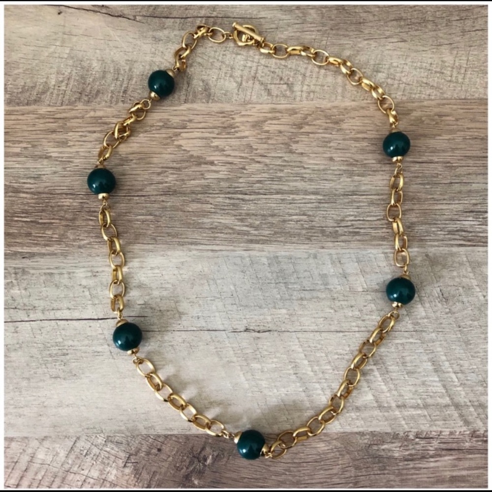 Gold plated and hunter green beaded, long necklace.